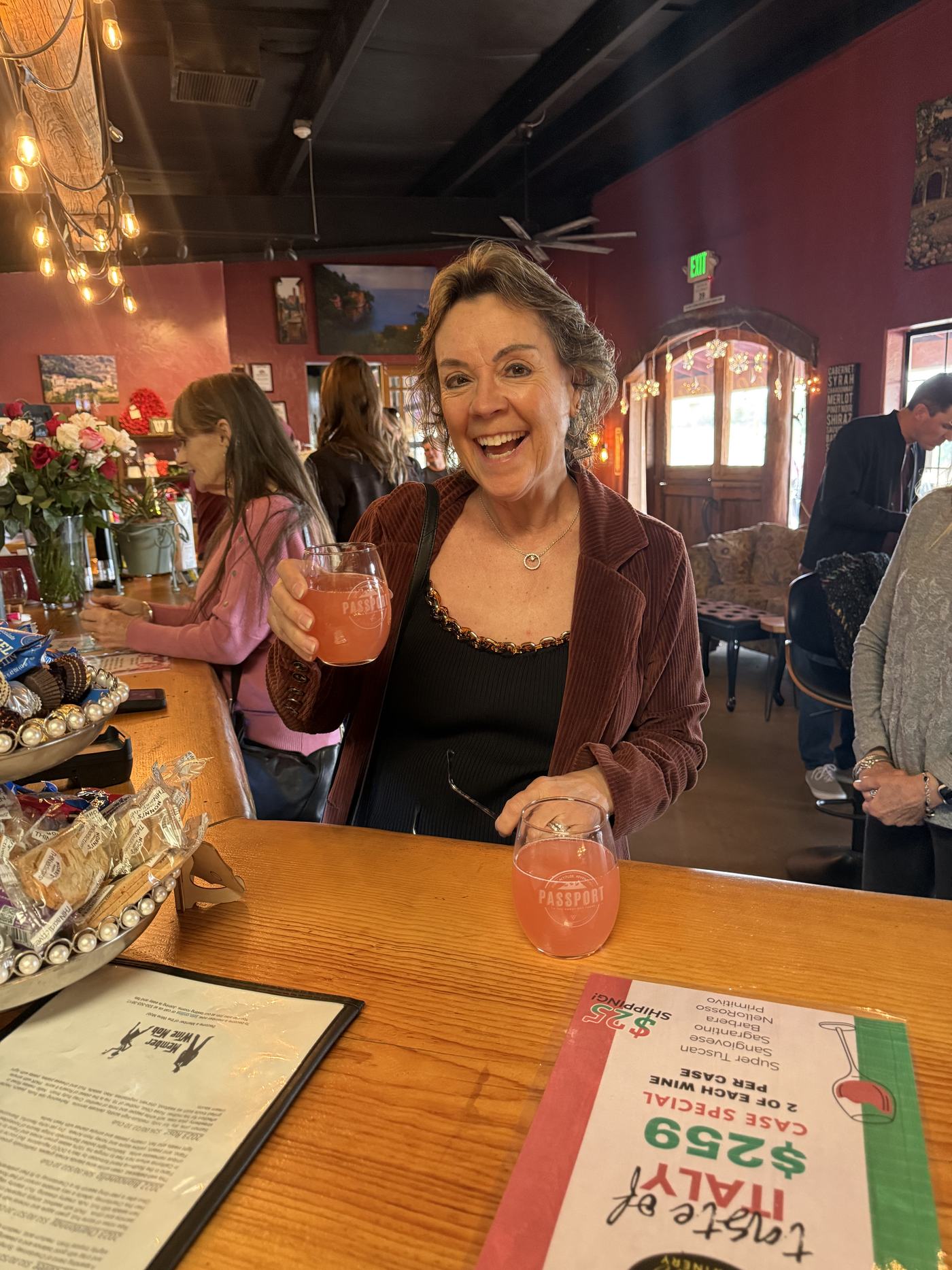 Friends raising glasses in the tasting room
