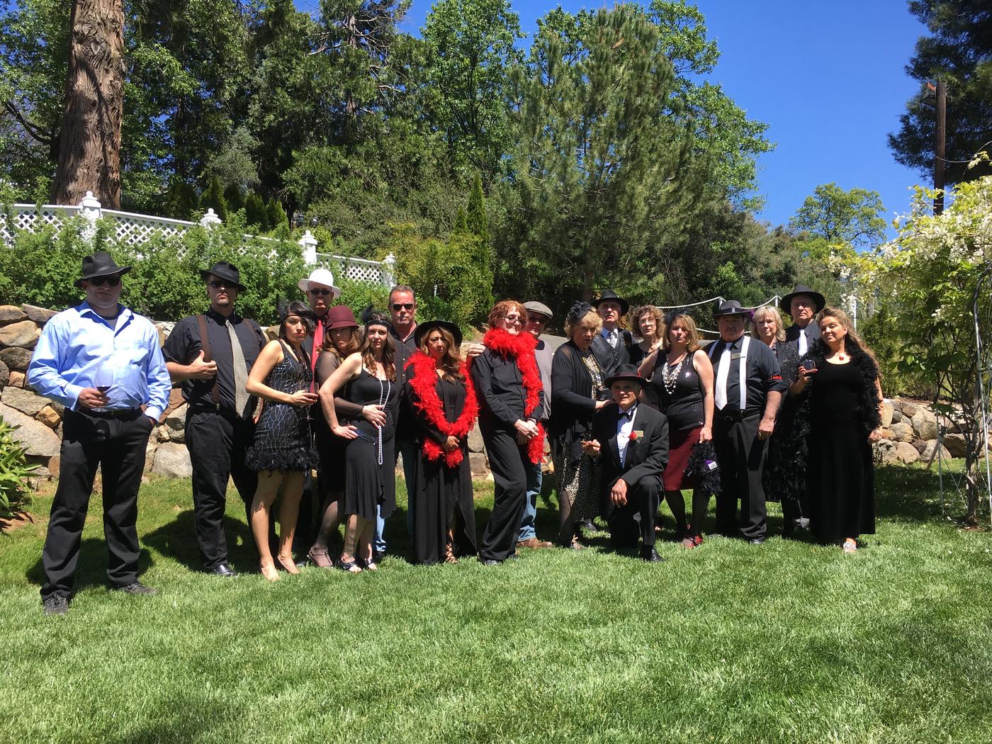 The Wine Mob gathered on the lawn in twenties dress