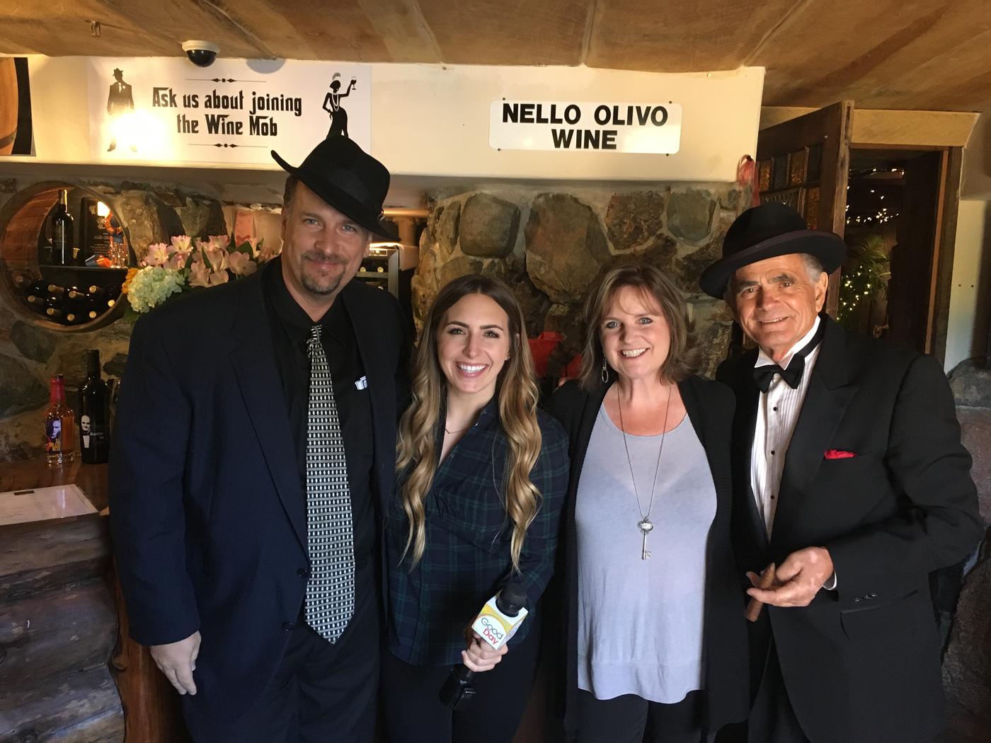 Four members dressed to the nines in the tasting room