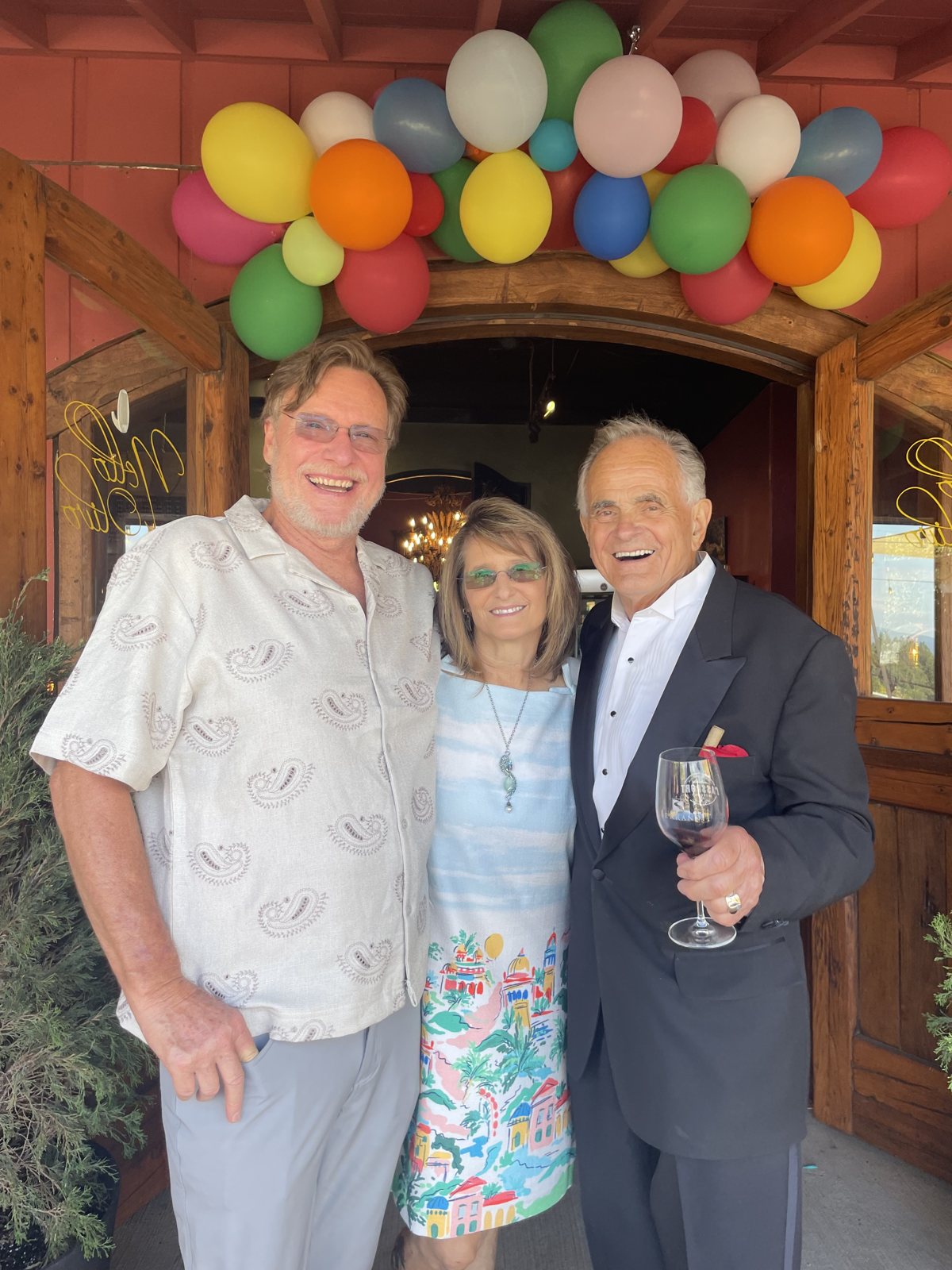 Nello under the balloon arch at the Camino door