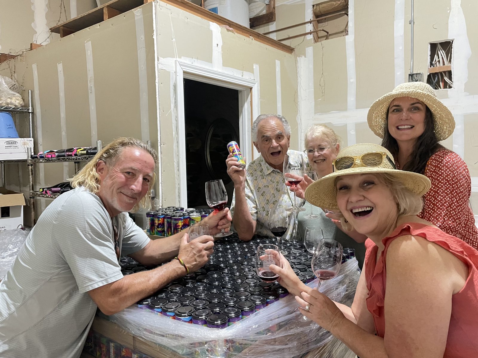 Friends pouring in the vineyard